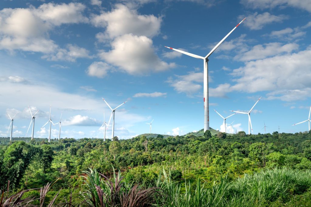 Wind Turbine Design Choices: Onshore vs. Offshore vs. Distributed — onshore wind turbines in rural landscape