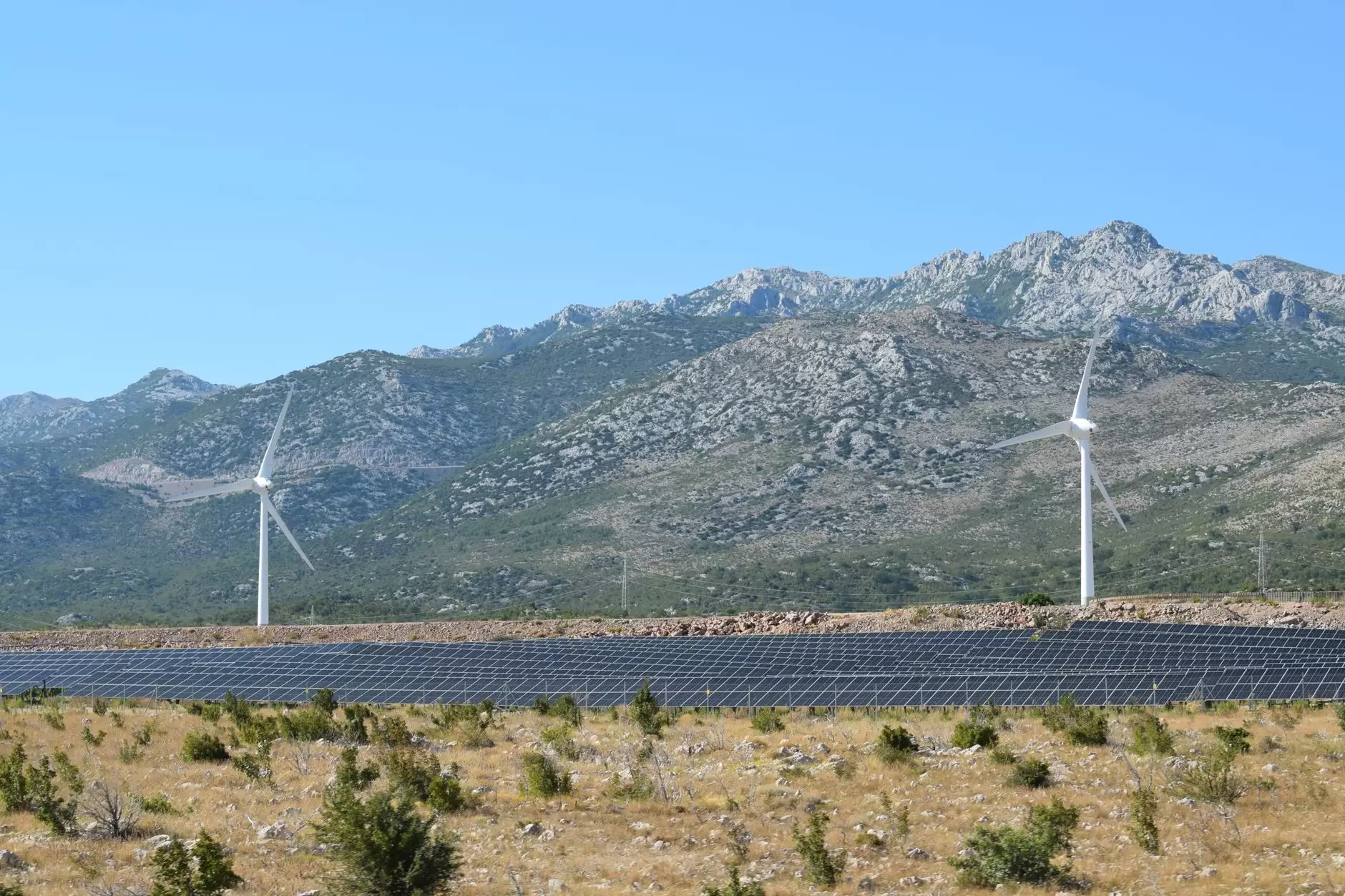 Asia-Pacific Energy Transition: A Regional Overview of Policy Drivers and Targets — solar panels wind turbines rolling hills