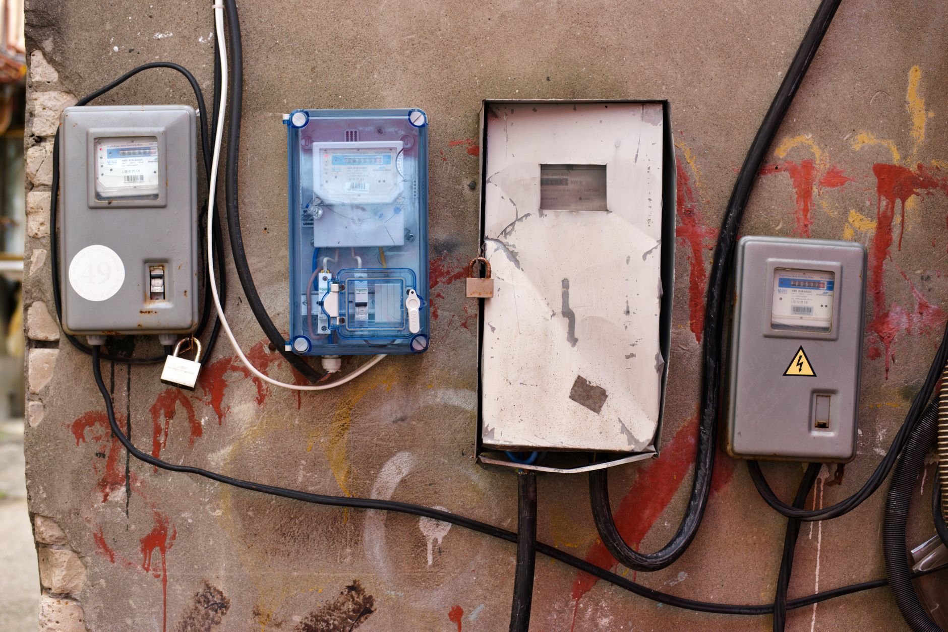 What Smart Meters Actually Do: From Consumption Data to Grid Intelligence — digital smart electricity meter mounted on an exterior residential wall with utility wiring