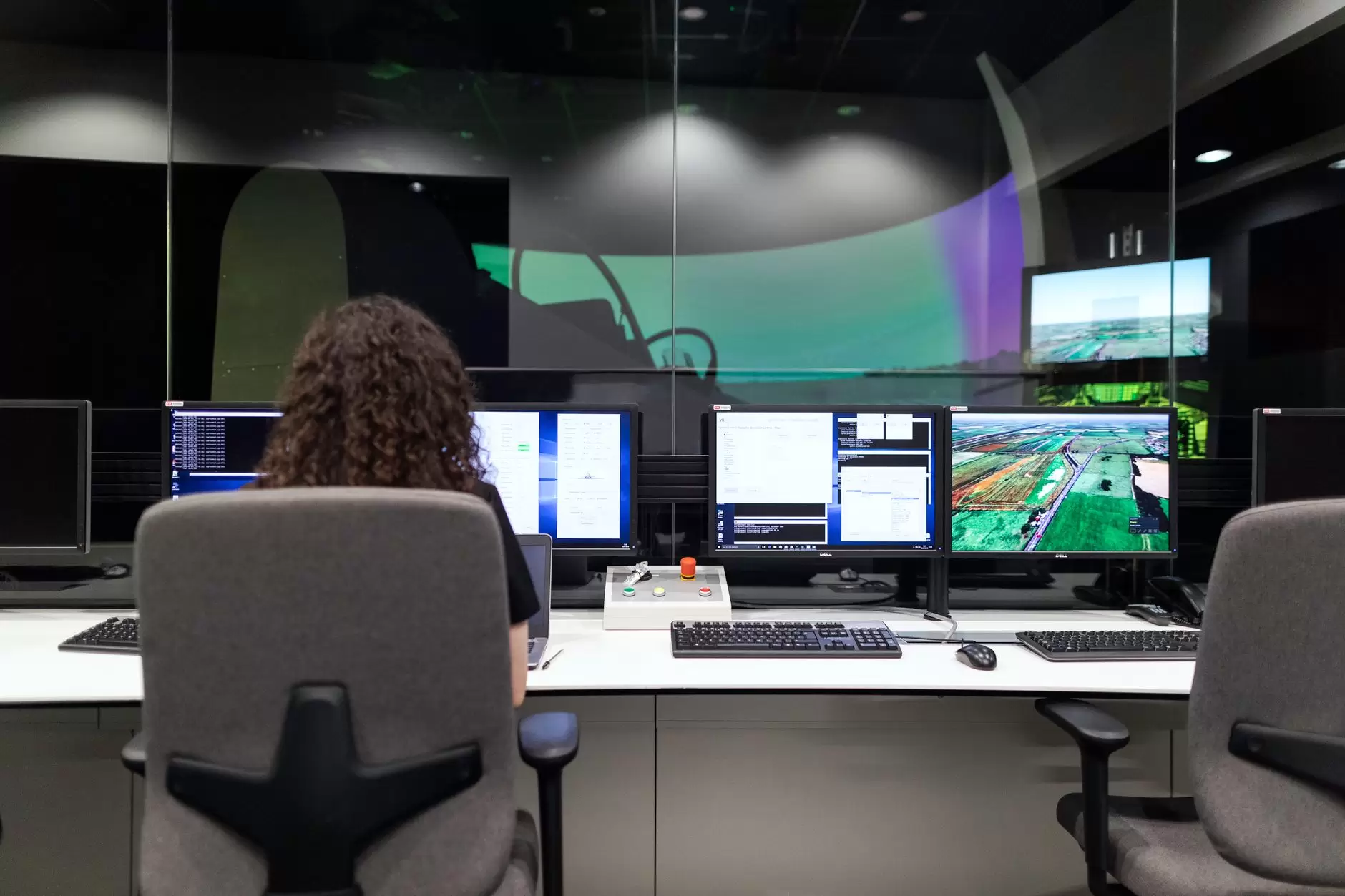 Cybersecurity in the Digital Grid: Operational Risks and Defense-in-Depth Strategies — utility control room operator monitoring multiple grid screens