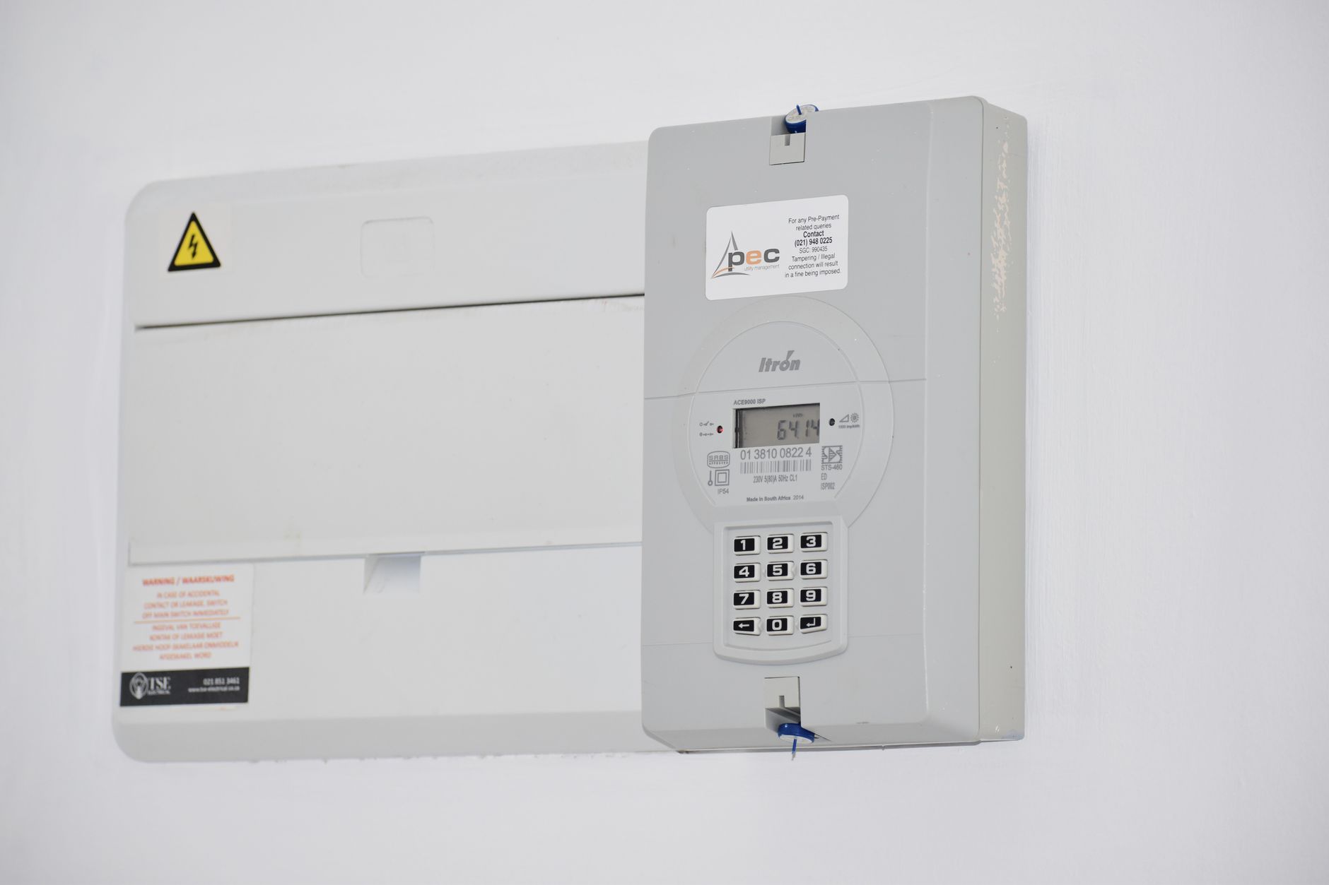 What Smart Meters Actually Do: From Consumption Data to Grid Intelligence — smart electricity meter mounted on exterior wall with digital display