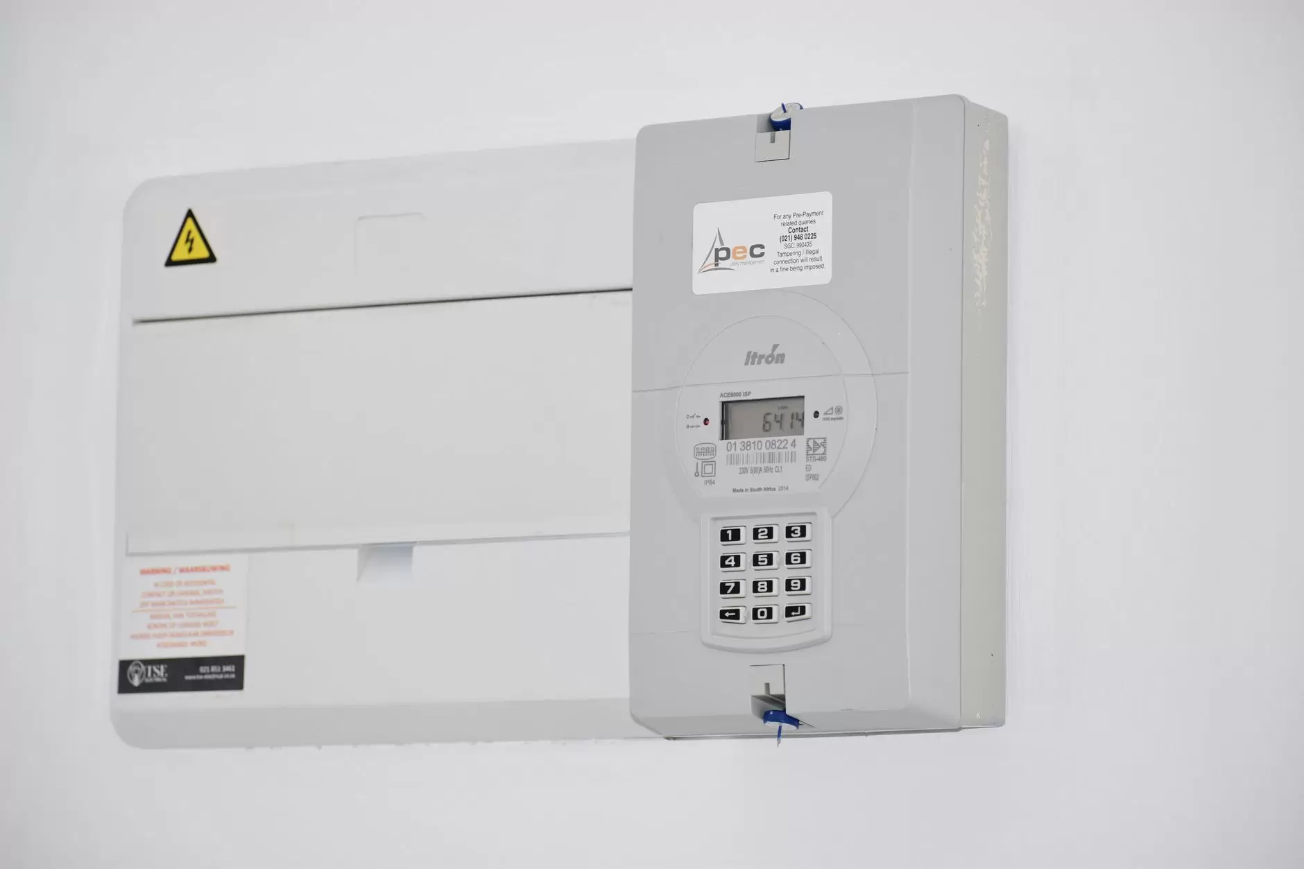 What Smart Meters Actually Do: From Consumption Data to Grid Intelligence — smart electricity meter mounted on exterior wall with digital display
