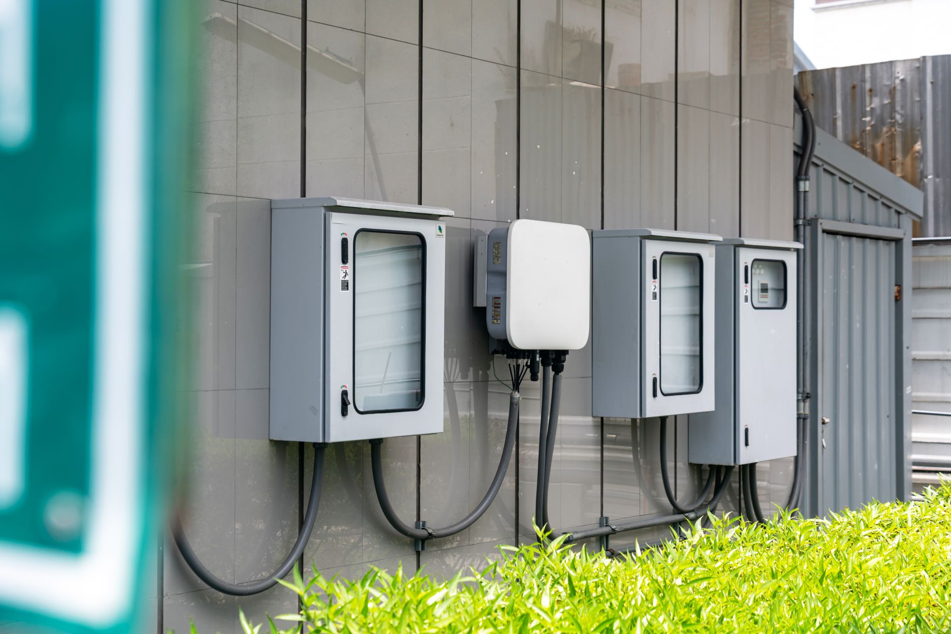 Cybersecurity in the Digital Grid: Operational Risks and Defense-in-Depth Strategies — electricity substation control equipment with relay panels and network cables