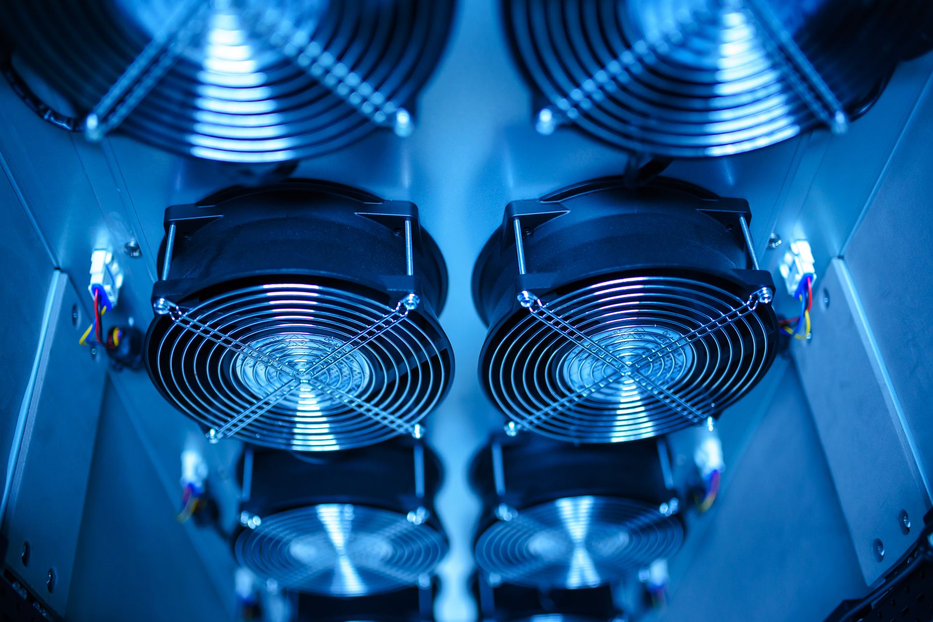 Beyond Power Purchase Agreements: The Challenges of 24/7 Carbon-Free Energy for Data Centers — large data center building with cooling equipment and power infrastructure at dusk