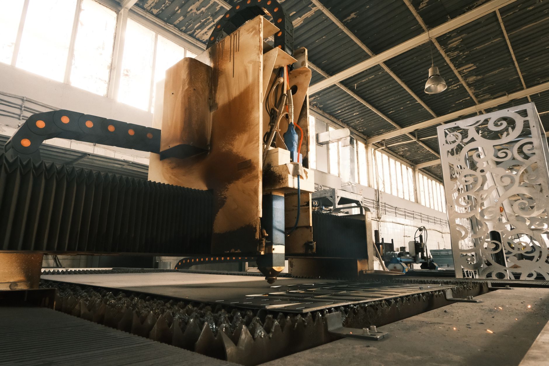 Industrial Demand Charges Explained: How Peak Kilowatts Determine Your Bill — industrial manufacturing plant interior with large electric motors and production equipment