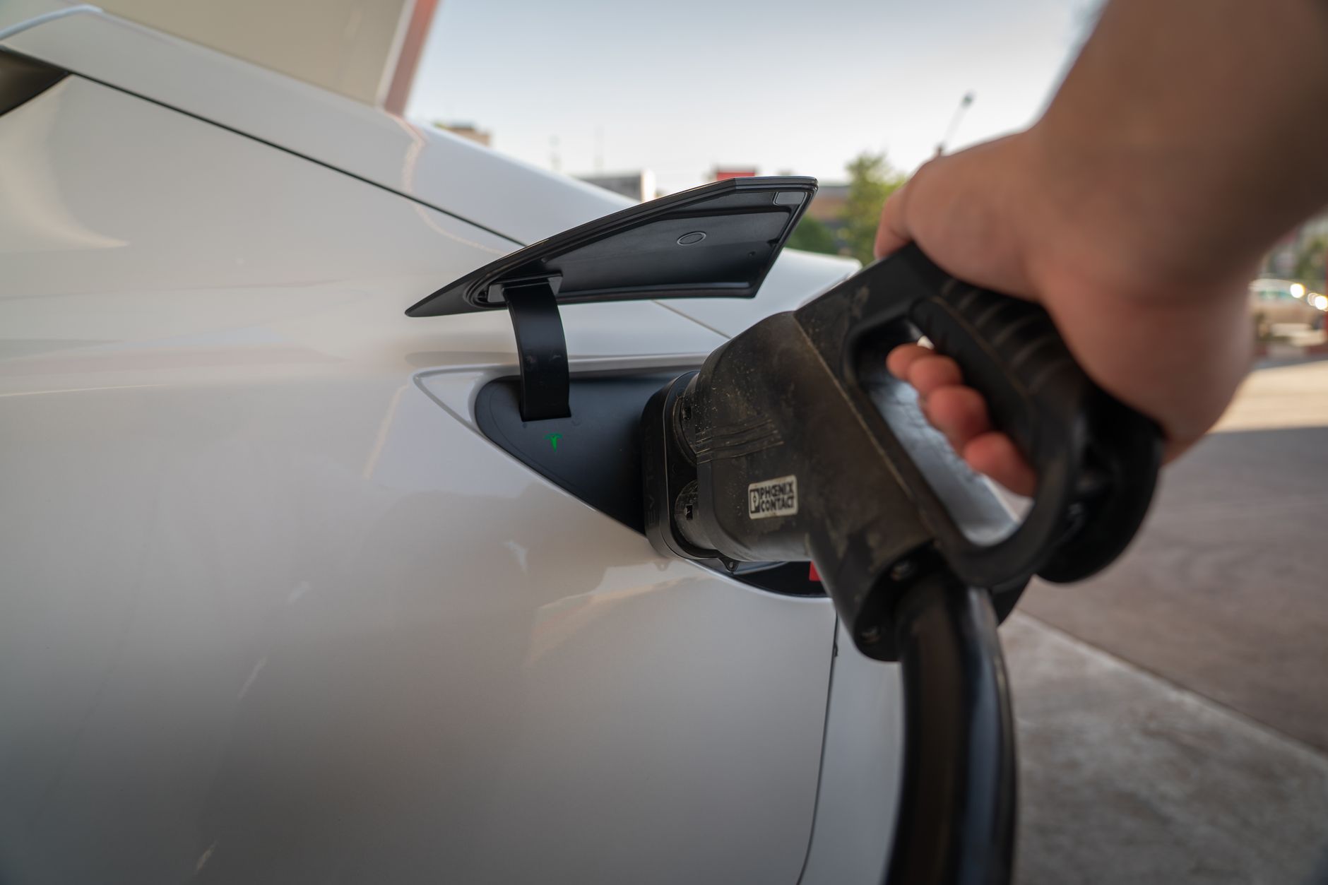 EV Charging Impact on the Grid: Separating kW Reality from the Headlines — electric vehicles charging outside suburban homes at dusk