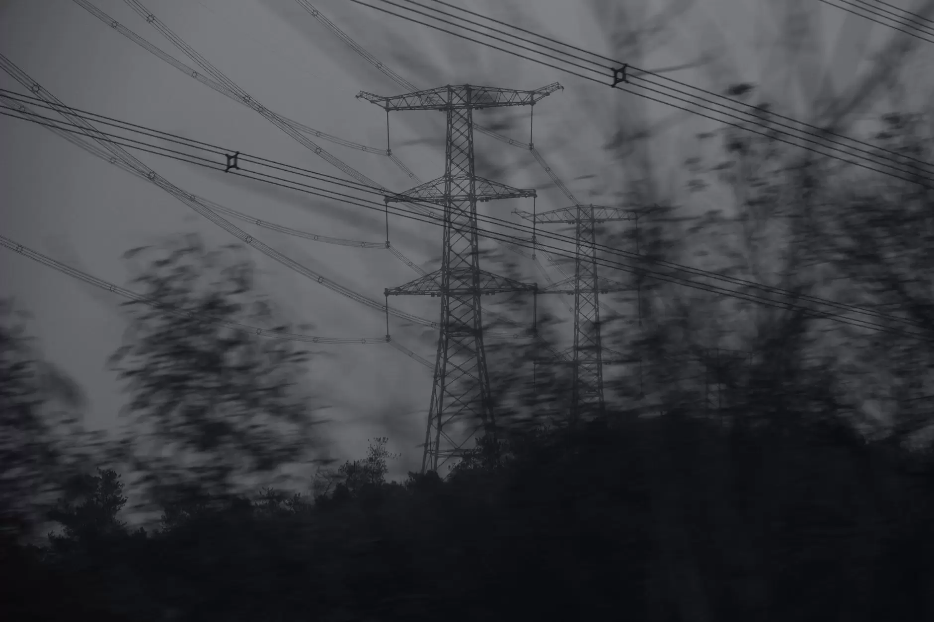 ASEAN Power Grid: Where Are We Now? — high-voltage transmission towers crossing a tropical Southeast Asian landscape