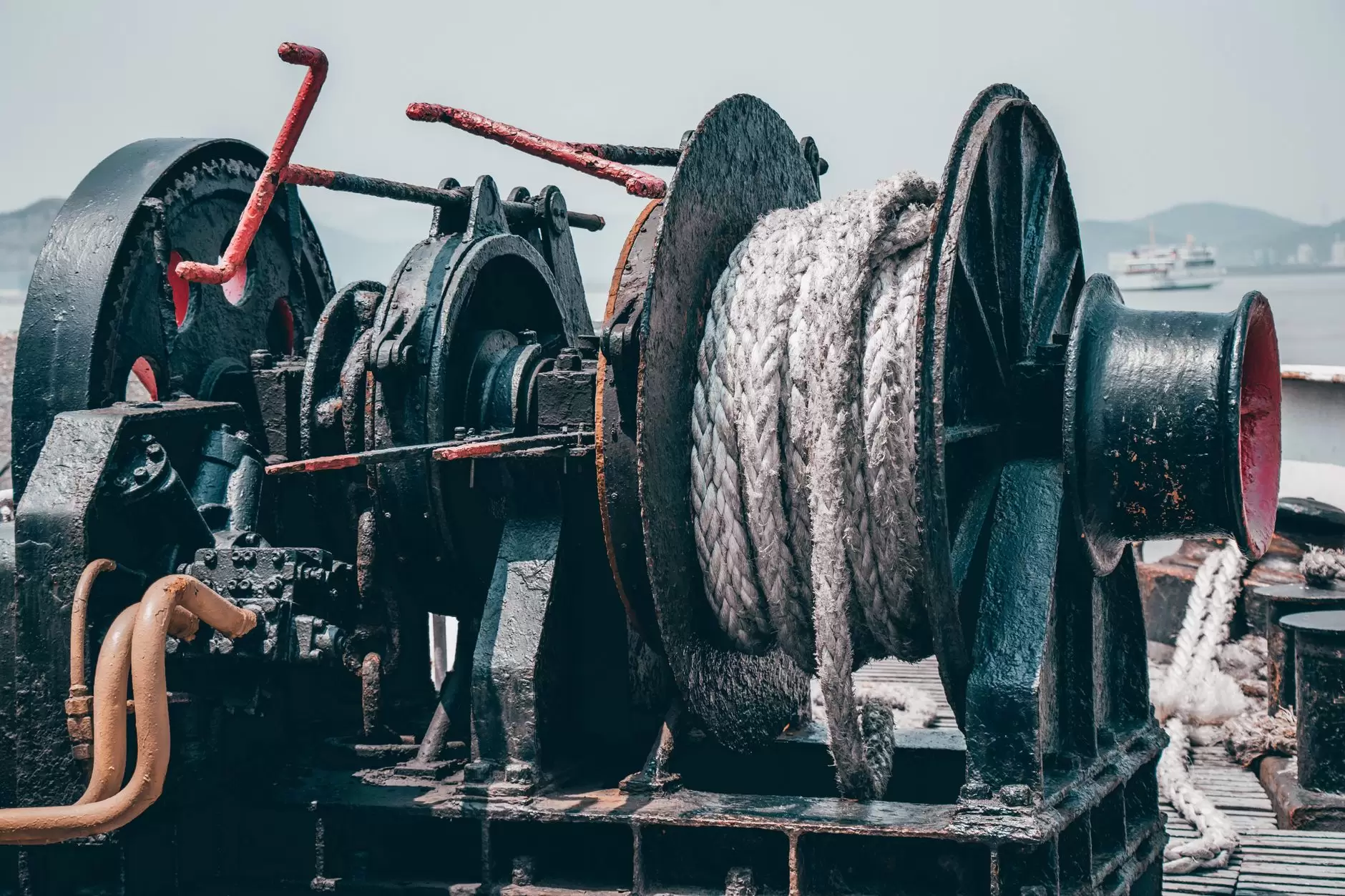 The Physical Layer: Submarine Cables and Cross-Border Interconnectors in Southeast Asia — submarine cable-laying vessel working offshore near Southeast Asian coastline
