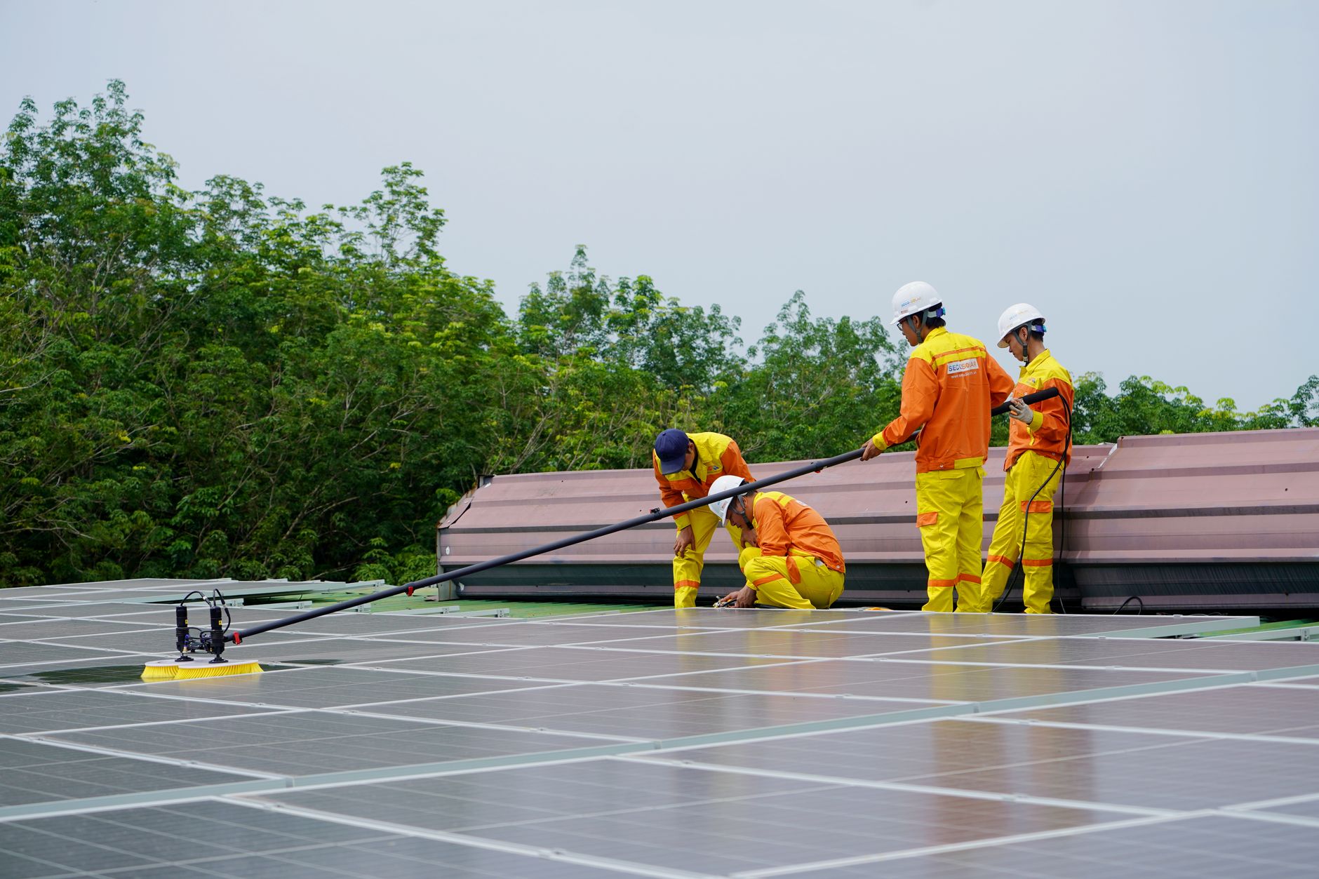 The Renewable Project Development Pipeline: From Lease to Commercial Operation — utility-scale solar farm construction with cranes and workers