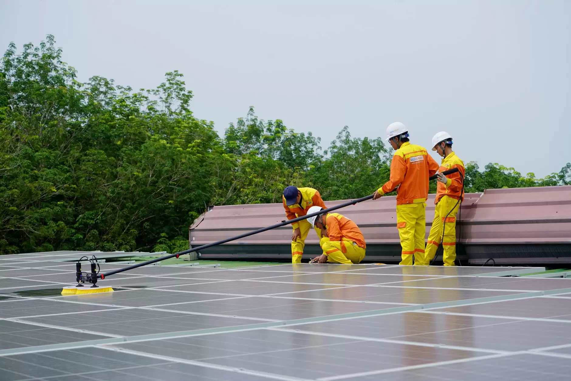 The Renewable Project Development Pipeline: From Lease to Commercial Operation — utility-scale solar farm construction with cranes and workers