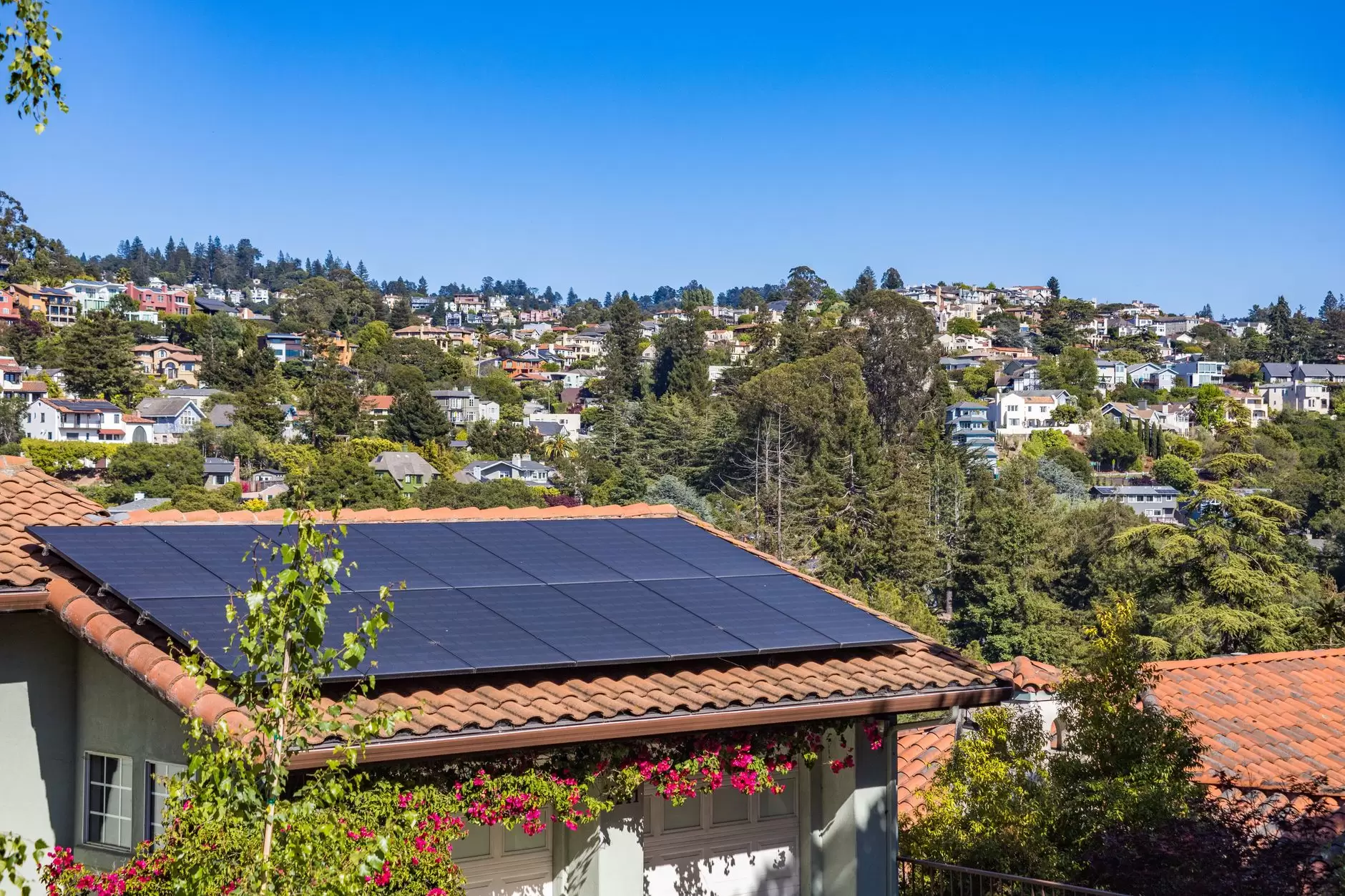 Pakistan's Solar Revolution: How Distributed Generation is Changing Grid Dynamics — rooftop solar panels across dense urban neighborhood in Pakistan